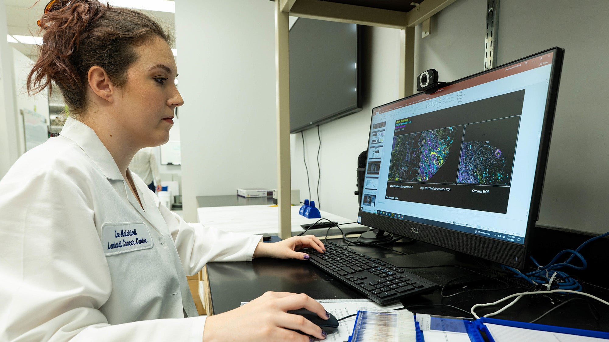 A researcher works at a computer